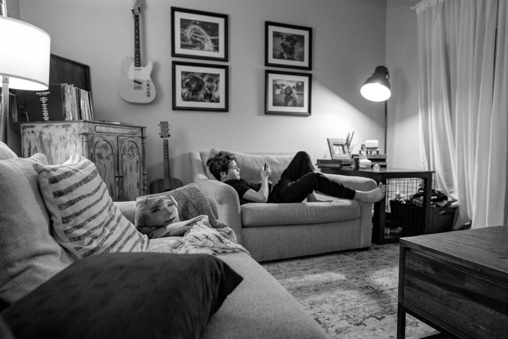 Family relaxing on oversized bean bag seating in a living room